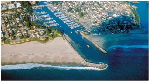   What coastal erosion stabilizers are visible in this image? A) Headlands B) Jetties C) Breakwaters D) Groins