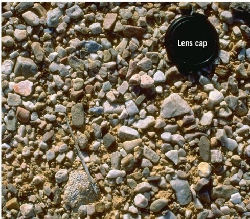   What desert feature is visible in this image? A) Playa lake B) Sand dune C) Desert pavement D) Yardang
