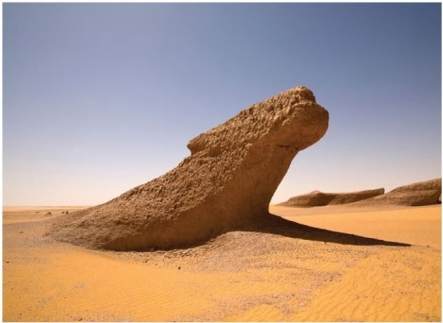   What feature is present in this image? A) Blowout B) Yardang C) Desert pavement D) Dune
