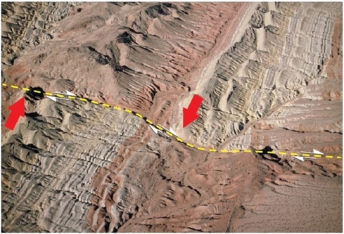   What kind of fault is present in this image? A) Normal fault B) Reverse fault C) Left-lateral strike-slip fault D) Right-lateral strike-slip fault