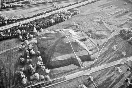 Questions refer to the map and image below. Commercial Hubs in Mesoamerica and North America c. 1000   Monks Mound, Cahokia Mounds State Historic Site   -Given the information on the map, what is a likely explanation for the shape of the mound at Cahokia? A)  The knowledge of pyramid-shaped ceremonial sites spread from the Mayan and Toltec cities to the Mississippi Valley civilizations. B)  The knowledge of pyramid-shaped ceremonial sites spread along the land trade routes to the Mayan and Toltec cities. C)  Pueblo people could not create ceremonial sites because they lacked large draft animals or rivers to transport construction material. D)  Mesoamerica and North America did not create ceremonial sites like those in Afro-Eurasia.