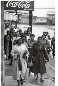 In this photo, taken during the Montgomery Bus Boycott in 1956, a group of black women are shown commuting on foot. What is significant about the demographic shown in this image?   A)  Black women made up the majority of bus riders, making their choice to boycott particularly effective. B)  Young women were the group most likely to boycott city buses in Montgomery. C)  Black women were not as vulnerable to intimidation and threats as black men. D)  Such walks were only popular among black women at the beginning of the boycott because they quickly gave up.