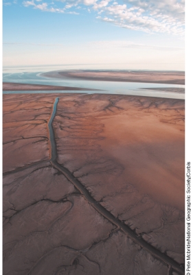 Why is this part of the Colorado River in Mexico dry?   A) Severe droughts have reduced water flow so that the river often dries up. B) So much water has been diverted for irrigation that the river often dries up. C) The Colorado is an intermittent river, which means it naturally dries up in the late summer. D) Dams built for hydroelectric power generation have cut off water to this region of the Colorado River.