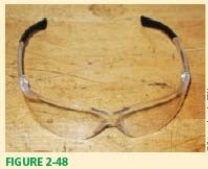 Technician A says that safety glasses shown in Figure 2-48 will protect against all types of hazards.Technician B says that work boots must meet the Z.87 safety standard.Who is correct?   A) Technician A B) Technician B C) Both A and B D) Neither A nor B