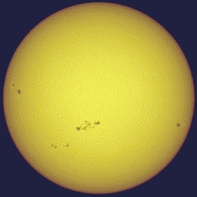 The figure shows the sun and pairs of sunspots. One could say that there is really a 22-year sunspot cycle because   A)  the time between sunspot number maxima is 22 years. B)  the time between maxima of the same magnetic polarity of sunspot pairs is 22 years. C)  it takes sunspots 22 years to move from the poles to the equator. D)  at maximum there are 22 sunspots per year.