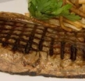 What item of equipment has been used to cook this steak?   A)  Sauté plate B)  Char grill C)  Salamander D)  Frying pan