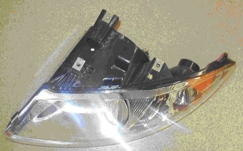 What type of headlight assembly is shown in the below illustration?   A) Concealed Headlight assembly B) Retractable C) Composite D) Sealed Beam