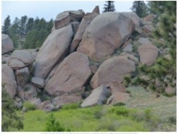 <strong>69)Which of the following processes is probably involved in the formation of the landscape shown in this photograph from the Connections two-page spread?  </strong> A)fracturing of an igneous rock, probably granite B)spheroidal weathering C)physical weathering D)chemical weathering E)all of these <div style=padding-top: 35px> 