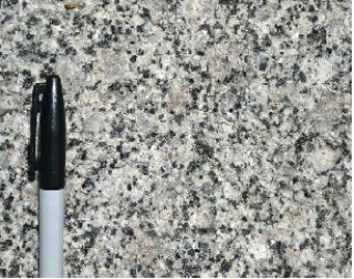 117) What type of rock is shown in this photograph from the Investigation?   A) granite B) volcanic rocks, probably basalt C) sedimentary rocks D) metamorphic rocks