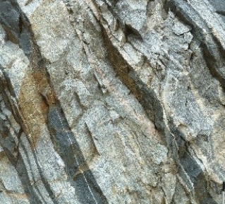 120) What type of rock is shown in this photograph from the Investigation?   A) sedimentary rocks B) granite C) volcanic rocks, probably basalt D) metamorphic rocks