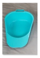 What is the best way to position the client on this bedpan?   A)  Have client lift hips and slide it underneath of him or her. B)  Roll the client on the side, place it against the buttocks, roll the client back. C)  Raise the head of the bed and have client use the overhead trapeze. D)  Assist client to standing position, then assist to sitting on the pan.