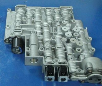 Identify the component shown in the given figure.   A)  Nickel coated valve body B)  Steel valve body C)  Aluminum valve body D)  Cast iron valve body