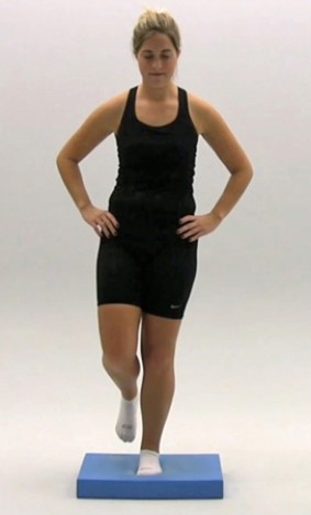 What is being performed for a head assessment in the following figures?       A)  Balance Error Scoring System (BESS)  B)  Romberg test C)  Cranial nerve testing D)  Motor testing E)  Strength testing