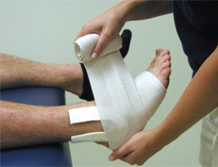 What is the pain purpose of the pad in this picture? A) Provide support to the lateral ankle B) Create a focal compression C) Provide stability for a bone fracture D) Prevent syndesmotic ankle sprains E) Provide support to the medial ankle