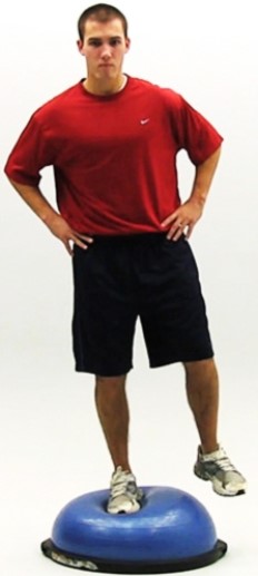 Which major component of a rehabilitation program is shown in the photo?   A)  Reestablishing neuromuscular control B)  Establishing/enhancing core stability C)  Restoring muscular strength, endurance, and power D)  Restoring range of motion E)  Regaining postural stability and balance F)  Maintaining cardiorespiratory fitness G)  Incorporating functional progression