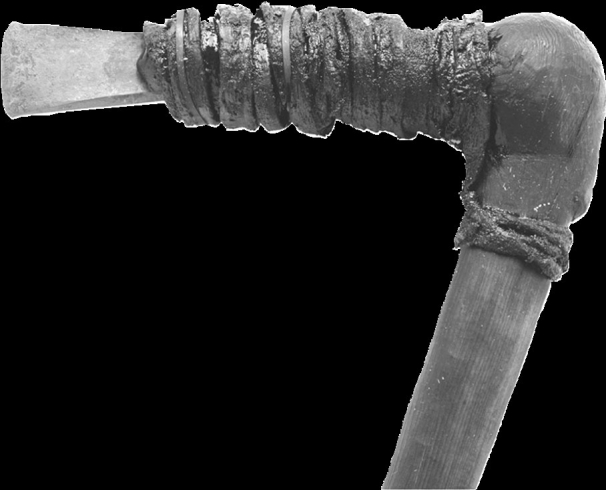 The copper axe reconstructed here would, historically, have been manufactured in which of the following periods?   A) The Chalcolithic B) The Mesozoic C) The Mesolithic D) The Upper Palaeolithic