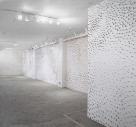   Donald Lipski's The Starry Night (figure 21.10A)  is Postmodern because: A)  It uses an unconventional material and expresses an emotion B)  It uses an element from pop culture and is an installation C)  It references a current problem and rejects a handmade feel D)  It references a prior artwork and uses an unconventional material