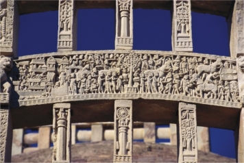   The gates of the Great Stupa at Sanchi (figure 18.9)  feature a tree, footprints, and an umbrella, because these items: A)  Showed that the Buddha's preaching reached out in all directions B)  Depicted the Buddha without using a human form C)  Helped Buddhists appeal to those who looked to the old ways D)  Made the relief decorative