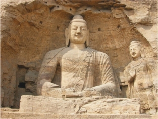   The colossal Buddha from the Yungang Caves (figure 18.22)  shows the mixture of the Buddhist faith and the Northern Wei dynasty by: A)  Being an icon of the Buddhist faith B)  Making the Buddhas resemble the emperors C)  Including bodhisattvas D)  Creating an ordered and peaceful society