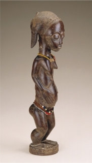   A Baule spirit spouse (figure 16.8)  exhibits which characteristics of traditional African art? A)  Boldness of form, naturalism, and promotion of status B)  Power of art, boldness of form, and fascination with the human form C)  Promotion of status, predominance of certain methods, and use of wood D)  Diversity of media, promotion of status, and boldness of form