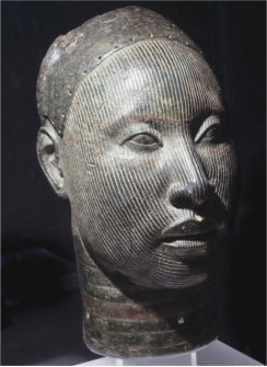   Naturalistic heads made by the Yoruba (figure 16.11)  in cast bronze are examples of: A)  Promotion of status, predominance of certain methods, and fascination with the human form B)  Power of art, boldness of form, and fascination with human form C)  Promotion of status, diversity of media, and power of art D)  Fascination with human form, diversity of media, and idealization