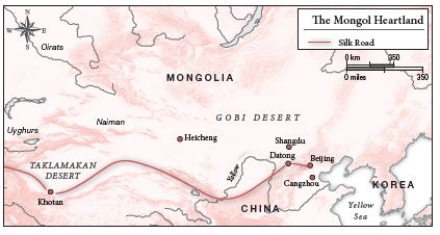   -Looking at Map 4.2, the Silk Road was ________ the traditional territory of the Mongols. A)  far from B)  the main axis of communication in C)  along the margins of D)  at the center of