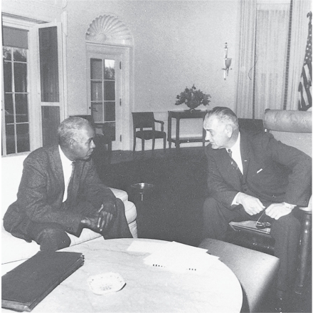   -This picture of Lyndon Johnson and NAACP leader Roy Wilkins shows A)  Johnson reaching out to various leaders, seeking support after Kennedy's assassination B)  Johnson's longtime commitment to civil rights C)  Johnson's commitment to segregation D)  Johnson's basic conservatism on civil rights