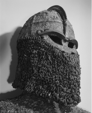   Which aspect of Viking tactics does this helmet best exemplify? A)  Using physical appearance to frighten the enemy B)  Rejecting metal in traditional armor C)  Learning crafts and artistic skills D)  Withdrawing quickly after an attack