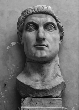   What do the facial features of Constantine suggest about this statue? A)  Constantine was unhappy with how he was portrayed in public art B)  According to legend, Constantine's eyes were oversized C)  The sculptor was not skilled enough to produce balanced features D)  It was large and imposing, meant to be viewed from a subordinated position