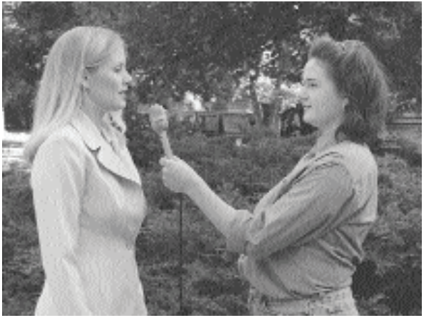 What, if anything, is wrong with this shot? (circle any answers that apply)    A)  Draws attention away from intended focus of the shot, the interviewee B)  It's aesthetically less pleasing than an OTS C)  Both eyes of interviewee are not visible D)  Wasted space in the center of the picture E)  There's nothing wrong with this shot at all