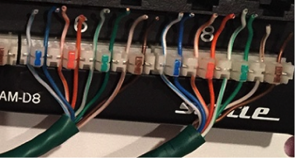 A technician is installing UTP cable and needs to terminate the connections on the patch panel shown in the following image.   What tool should be used to terminate and complete this installation? A)  Crimper tool B)  Punchdown tool C)  Cable stripper D)  Network multimeter