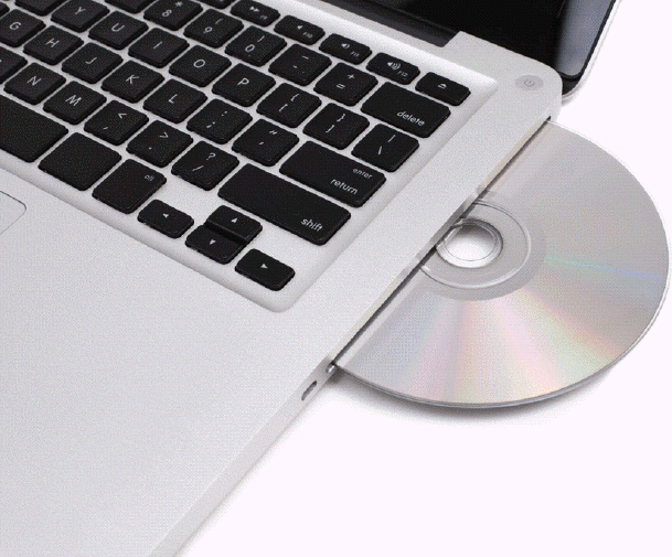   Which of the following is a good practice to follow to avoid scratching or damaging a disc like the one in the accompanying figure? A)  Hold the disc by its edges. B)  Stack the discs whenever possible. C)  Touch the underside of a disc. D)  Do not worry about exposing discs to any type of contaminant.