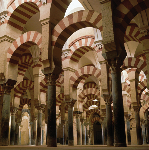   Which feature characterizes the Great Mosque of Cordoba ? A) The use of pattern has a spiritual meaning, reflecting the creation of the world by Allah. B) Its arches' alternating beige and terracotta bands incorporate biomorphic forms. C) Its arches rest on rectangular piers. D) Its arches' pattern both incorporates biomorphic forms and has a spiritual meaning tied to Allah's creation.