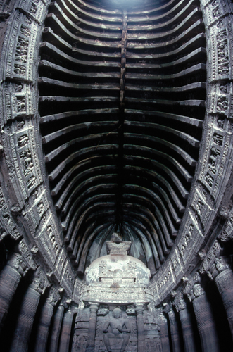 <strong> What influences our perception of the Ajanta Caves in India?</strong> A)The overall composition of the group of caves is organized using radial balance. B)The relativity of color perception emphasizes the Parinirvana sculpture. C)Through the unfolding process of time and motion, the viewer gradually experiences a dazzling interior space. D)Isometric perspective is used to convey its spatial complexity.