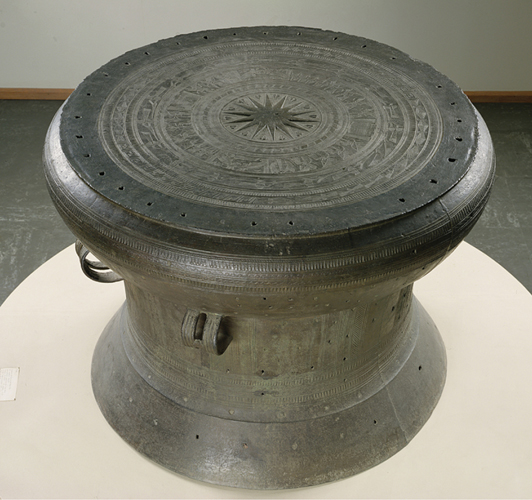 <strong> How has perception of the Dong Son civilization Drum changed since it was made millennia ago?</strong> A)Once used in rituals, it is now incorporated into community-building rituals. B)Once used in rituals, it is now in a museum, silent and viewed as a work of art. C)Once used in rituals, it is now understood as key evidence in the history of music. D)Once used in rituals, it now contributes to our historical understanding of trans-Asian migration.