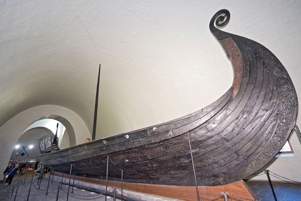 ​   Which of the following statements is true about the Viking Ship ? A) It probably was used by the Viking elite to sail nearby, and then was repurposed for burial. B) It was a rare example of a tomb that has been untouched since the time of burial. C) It was the ship used by the hero Beowulf. D) It functioned as a reliquary, holding relics of the most venerated Viking saints.