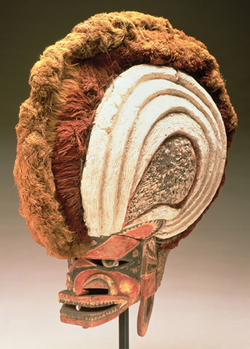 <strong> How was the Helmet Mask (Tatanua)used?</strong> A)This mask from Papua New Guinea helped the wearer to transition to adulthood. B)Such masks were a conduit for spirits to be present in the villages. C)This mask was worn for personal adornment and to advertise high status. D)This mask protected the wearer's face during the fire ceremony.