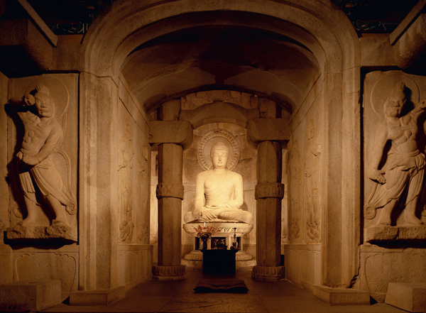 ​   What is the location of the structure and statue depicted here? A)  Yingxian B)  Gyeongju C)  Seokguram D)  Xi'an