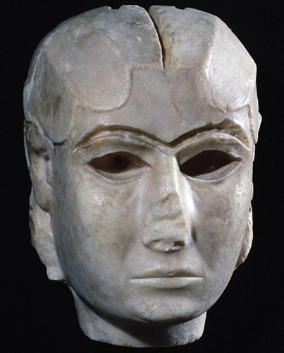 ​   Of the original components that made up this statue, which used the rarest material? A)  Gold-leaf wig B)  Wood body C)  Marble face D)  Embroidered garment