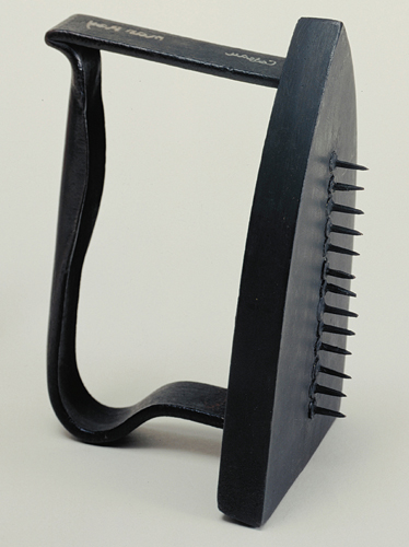 <strong> Which photographer sought to startle viewers with images of everyday objects with surprising elements added, such as this Cadeau ( Gift )?</strong> A) Dorothea Lange B) Margaret Bourke-White C) Alexander Calder D) Man Ray