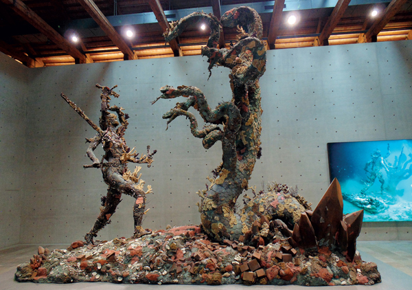 <strong> Damien Hirst's postmodern series of sculptures, including Hydra and Kali (shown here), for the Venice Biennale, gathered a group of objects from the history of art under the pretext that they came from where?</strong> A) The Library of Alexandria B) A museum in Iraq C) The home of a wealthy collector D) A shipwreck