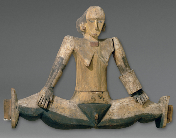 ​   What is the term for this figure, placed over the entrance of a Belau bai as a means of invoking fertility and protection? A)  Manulua B)  Dilukai C)  Kautaha D)  Tatanua