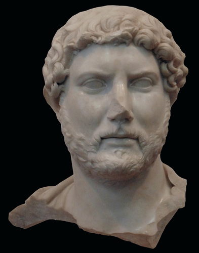 <strong> What is unusual in this portrait of a Roman emperor?</strong> A) Marble B) Deep cut curls C) Shape of mouth D) Beard