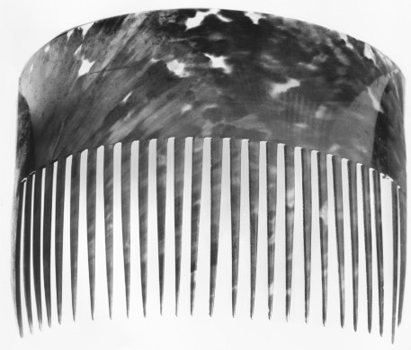 This handmade comb is made of ____.   A)  Bakelite B)  horn C)  shellac D)  tortoiseshell