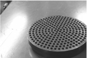 The part of an extruder shown here is ____.   A)  feed section B)  hopper C)  head clamp D)  breaker plate