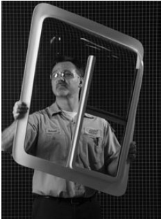 This image shows an acrylic bubble-formed side window for a helicopter. What is most likely to have formed this product?     A)  free forming B)  trapped-sheet contact-heat pressure forming C)  mechanical forming D)  pressure-bubble vacuum snap-back forming