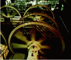 The San Francisco cable cars travel by clamping onto a steel cable that circulates in a channel beneath the streets. This cable is driven by a large 12-foot-diameter pulley, called a sheave (see the figure). The sheave turns at a rate of 17 revolutions per minute. Find the speed of the cable car, in miles per hour, by determining the linear velocity of the cable. (1 mi = 5,280 ft)​   ​  If the answer needs rounding, round it to the nearest hundredth. __________ mph